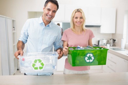 Community members participating in white goods recycling